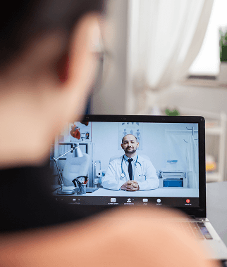 Patient attending an online consultation with a doctor