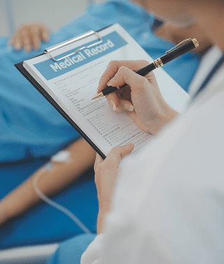 Healthcare professional reviewing a patient’s medical record