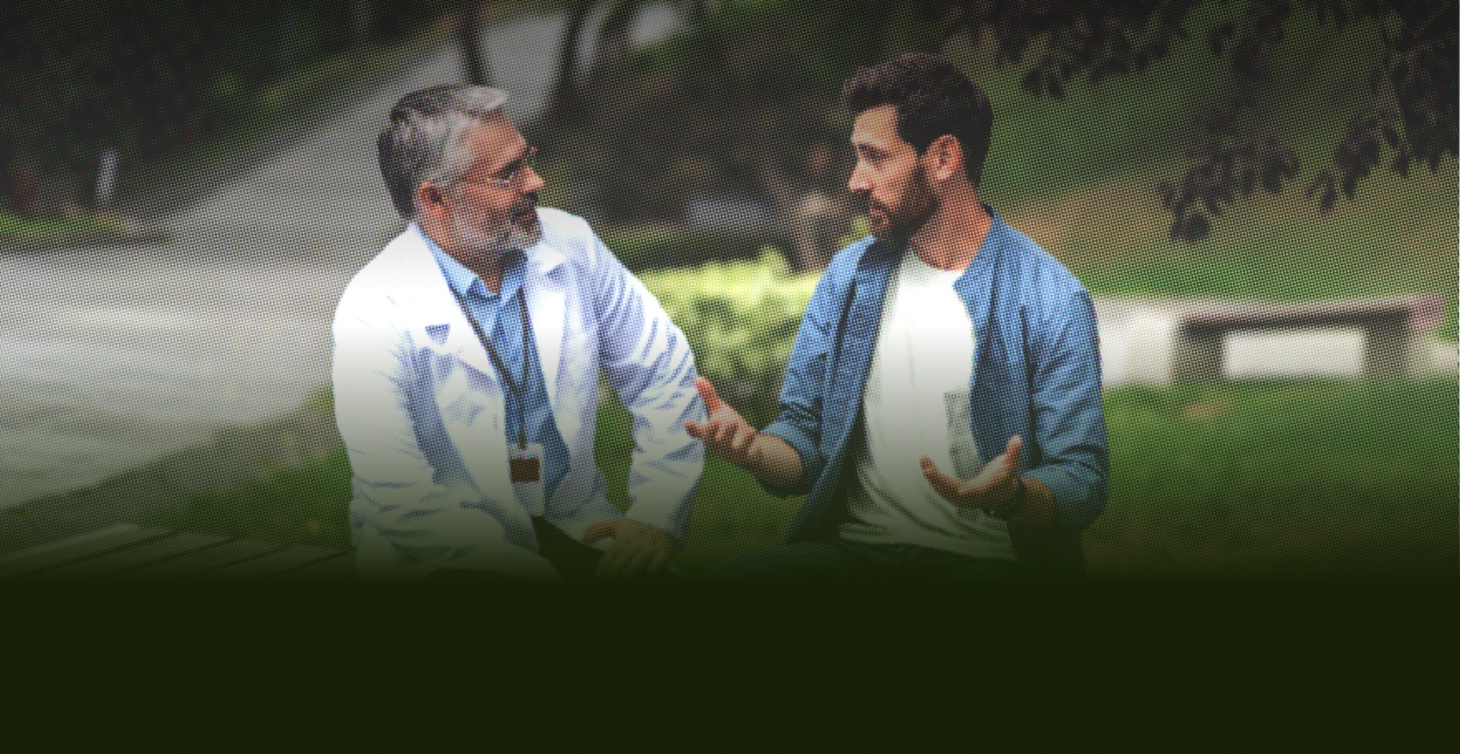 A patient discussing his symptoms with a doctor outdoors